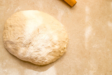 Hand knead dough on cutting board for homemade bakery