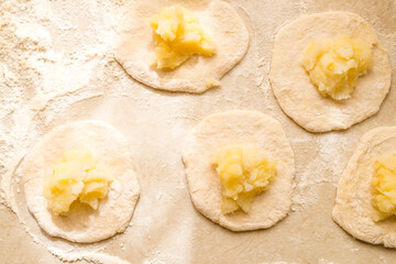 Hand knead dough on cutting board for homemade bakery