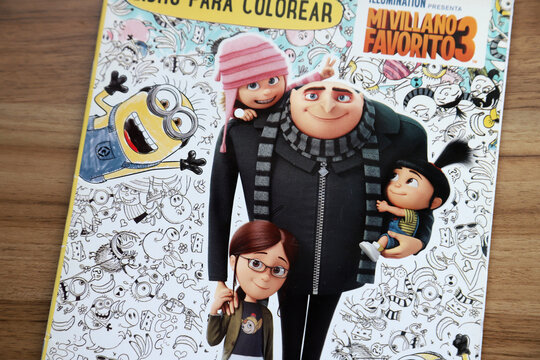 Gru with his daughters Agnes, Edith and Margo. Minions. Gru. Villain Gru. Family of Gru. Characters from the famous Despicable Me movies.  
Coloring magazine.