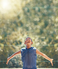 Happy, excited and shouting basketball child with a smile outdoor on sport court. Black boy playing, enjoy and fitness while training, exercise or practice during summer at sports club with happiness
