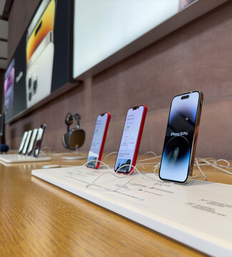 Paris, France - Sep 16, 2022: Square image of whole range of Apple Computers iPhone 14, 14 Pro, Pro Max on sale during the launch day featuring Always-on display, 48-megapixel Main camera