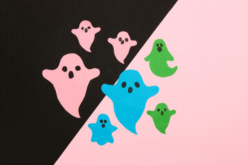 colorful ghosts on black and pink background, creative art design, halloween minimal concept
