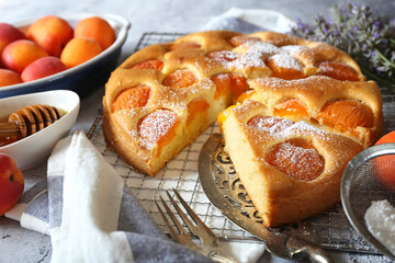 Homemade apricot pie with honey and dry lavender, powdered sugar dressing - 531541759