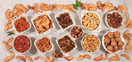 Assortment of various nuts and dried fruits, store banner, healthy natural food concept, almonds, nuts, pecans, pistachios, cashews, walnuts and pine nuts, apples, raisins, dried apricots
