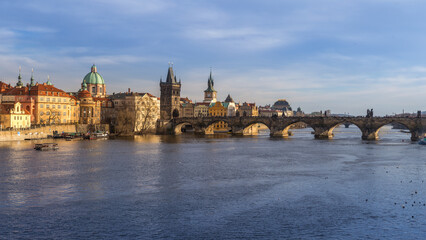 Side view of Charles Bridge in Prague on the banks of the Vltava River