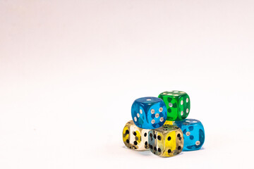 Transparent color plastic dices, green yellow blue and white