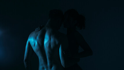 couple in the dark. Sexy couple. Sexual. Erotica. Passion. Passionate concept. Dark. Photo. 