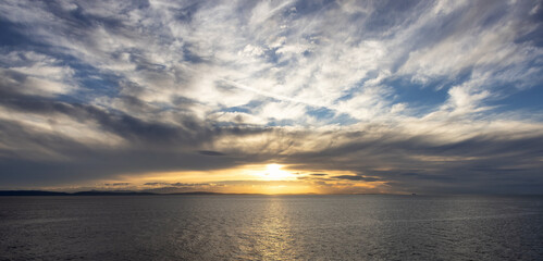 Cloudy Cloudscape during sunny summer Day on the West Coast