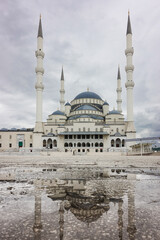 Fototapeta na wymiar Kocatepe Mosque and rain water pool reflection - Ankara, Turkey
