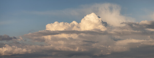 Puff Clouds in the Sky during sunset. Zoom in.