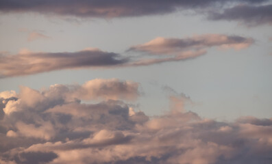 Puff Clouds in the Sky during sunset. Zoom in. Cloudscape Background.