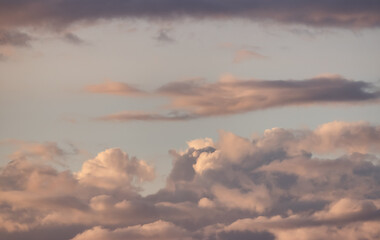 Puff Clouds in the Sky during sunset. Zoom in. Cloudscape Background.