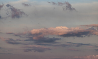 Puff Clouds in the Sky during sunset. Zoom in. Cloudscape Background.