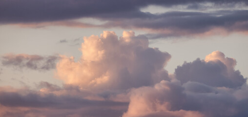 Puff Clouds in the Sky during sunset. Zoom in.