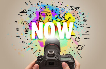 Close-up of a hand holding digital camera with abstract drawing