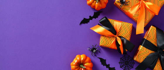 Happy Halloween banner. Festive background with gift boxes, orange pumpkins, bats, spiders on...
