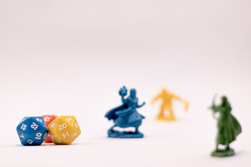 Role play game dices and figures of a mage and a dwarf