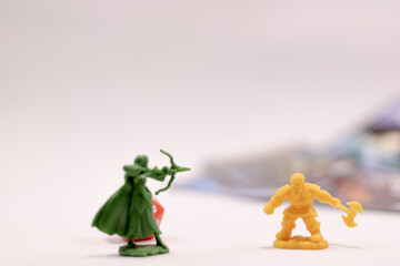 Role play game figures and cards in the background
