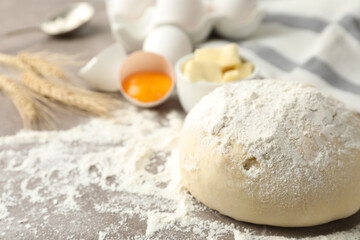 Wheat dough and products on table, closeup view with space for text. Cooking pastries