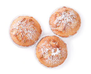 Tasty muffins powdered with sugar on white background, top view