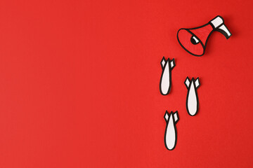 Paper megaphone and bombs on red background, flat lay with space for text. Hybrid war concept