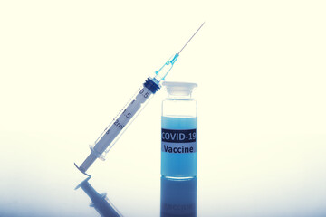 coronavirus vaccine with a syringe on a white background. the concept of mandatory vaccinations