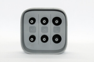 Various sizes of ear tips  ear buds for in ear headset, isolated in white background.