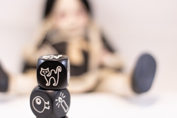 Living Dead Doll and Dices with symbols