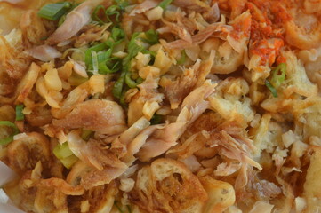 Chicken porridge is a porridge from Indonesia. Porridge made from rice ingredients cooked in a lot of water, mixed with a few small pieces of fried chicken and spring onions, has a soft texture