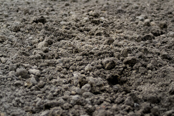 Defocus black land for plant background. Side view. Agriculture concept. Blurred. Copy space. Out of focus