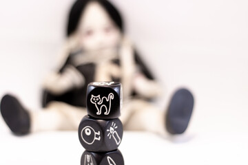 Living Dead Doll and Dices with symbols