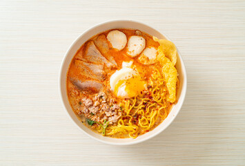 egg noodles with pork and meatball in spicy soup