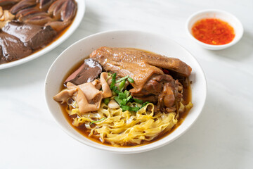 egg noodles with stewed and braised duck in brown soup