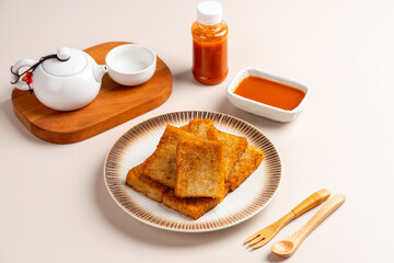 Turnip cake (Chinese : Chai tow kway ). Turnip cake  is a common dish or dim sum of Teochew cuisine in Chaoshan, China usually cut into rectangular slices and sometimes pan-fried before serving.