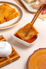 Raw Turnip cake (Chinese : Chai tow kway ). Turnip cake  is a common dish or dim sum of Teochew cuisine in Chaoshan, China usually cut into rectangular slices and sometimes pan-fried before serving.