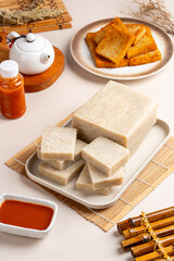 Raw Turnip cake (Chinese : Chai tow kway ). Turnip cake  is a common dish or dim sum of Teochew cuisine in Chaoshan, China usually cut into rectangular slices and sometimes pan-fried before serving.