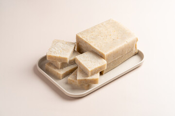 Raw Turnip cake (Chinese : Chai tow kway ). Turnip cake  is a common dish or dim sum of Teochew cuisine in Chaoshan, China usually cut into rectangular slices and sometimes pan-fried before serving.