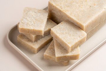 Raw Turnip cake (Chinese : Chai tow kway ). Turnip cake  is a common dish or dim sum of Teochew cuisine in Chaoshan, China usually cut into rectangular slices and sometimes pan-fried before serving.
