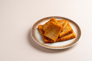 Turnip cake (Chinese : Chai tow kway ). Turnip cake  is a common dish or dim sum of Teochew cuisine in Chaoshan, China usually cut into rectangular slices and sometimes pan-fried before serving.