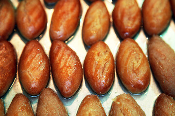 Traditional Turkish dessert 'Sekerpare' on the dessert plate.