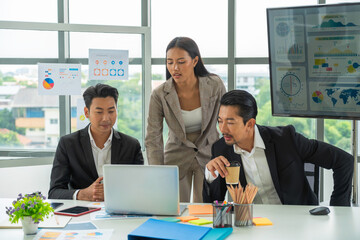 Teamwork of young asian entrepreneurs analyzing data.