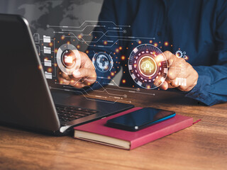 A businessman login into cloud computing by fingerprint on the virtual screen while sitting at the table