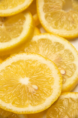 close up of yellow lemon slices, fresh cut lemon slices used to create savory dishes, lemonade, lemon desserts, lemon water