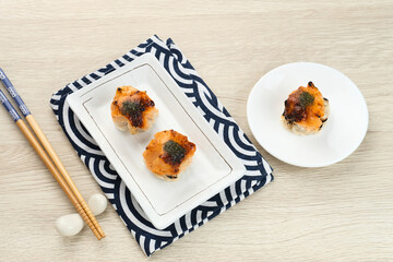 Dimsum with Japanese Mentai Sauce. Served on plate.

