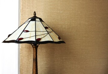 Vintage table lamp over white and brown background