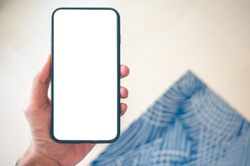 Close up men using a smartphone with an empty white screen at home.