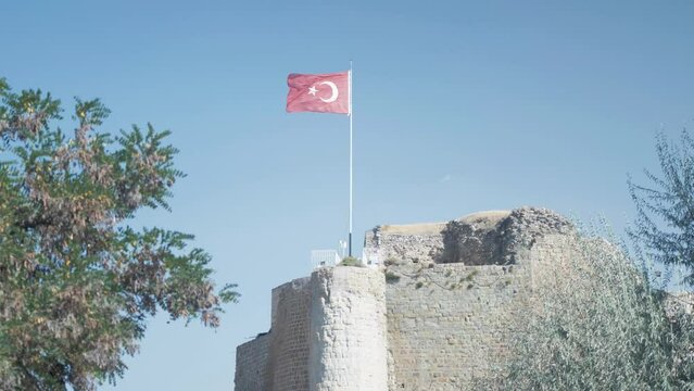 Turkish flag flys atop Harput historic castle