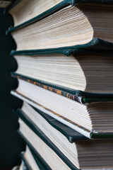 several books are stacked on top of each other