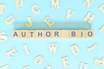 Author bio or biography part of a book concept. Wooden blocks typography word flat lay in blue background