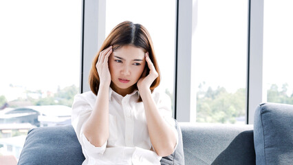 Stress asian women headache have migraine feeling temples stressfull upset depressed. Strong headache migraine exhausted young girl. Office syndrome unhealthy Tension person. Woman headache concept